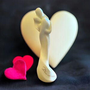 White porcelain man/woman hugging